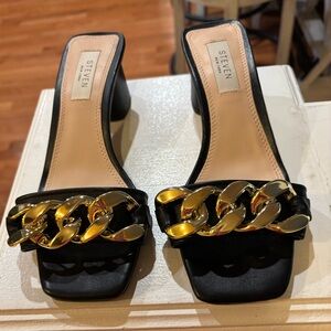 Seven7 Black Mules with Gold Chain Accent
